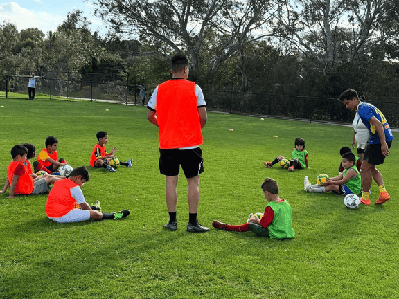Children learning football together at the Tigers academy