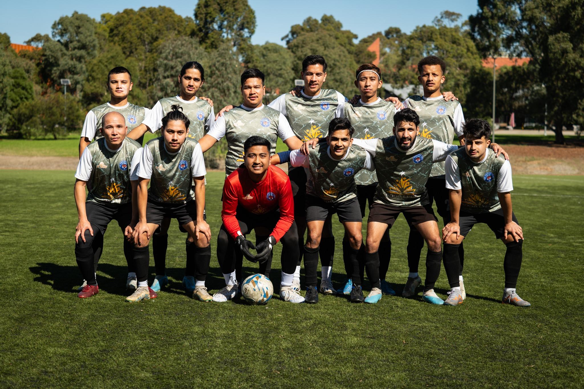 The Tigers team lined up in grey kits before a match