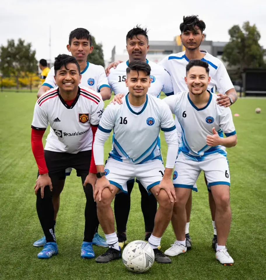 Players in white kits posing together