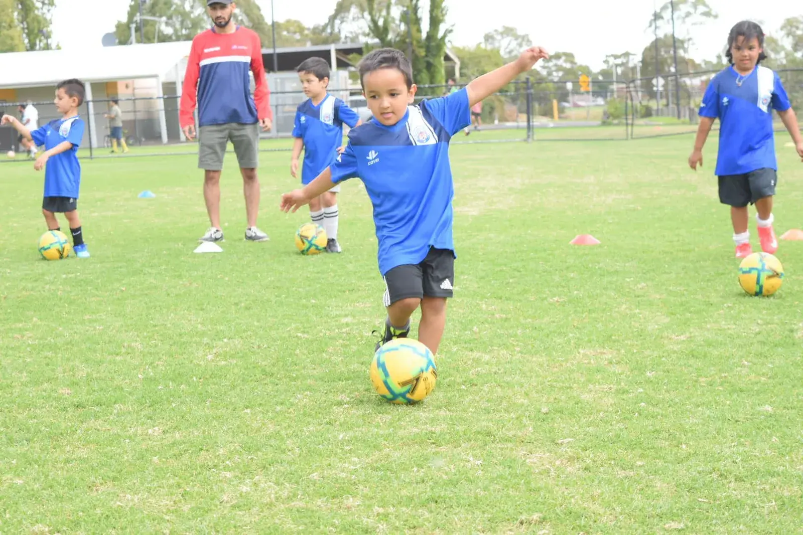 Young player dribbling towards the camera