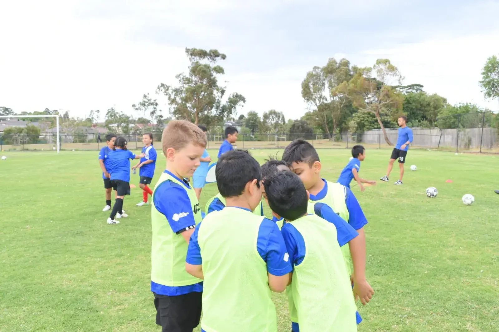 Young Tigers listening during training