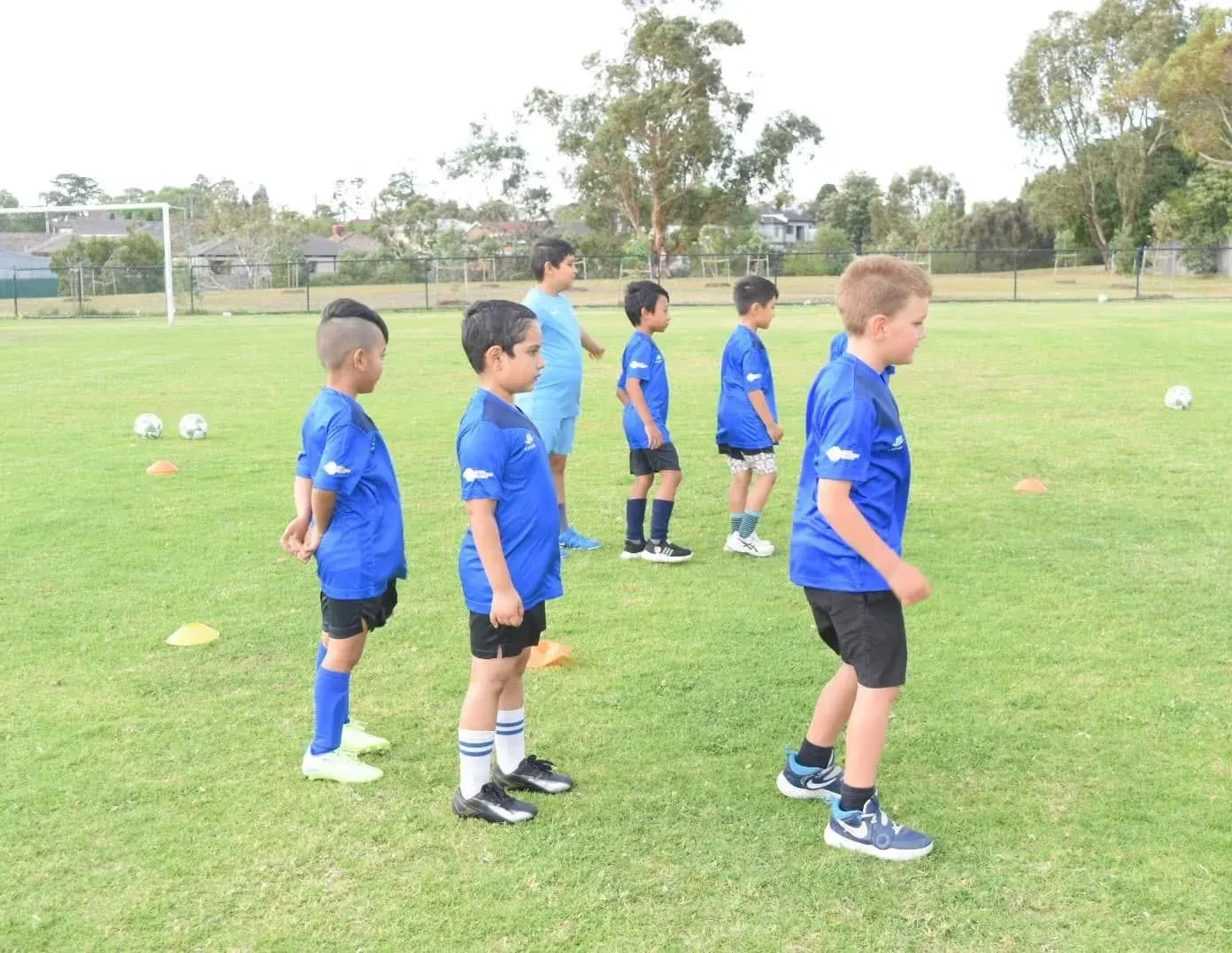 Young players waiting for their turn in a drill