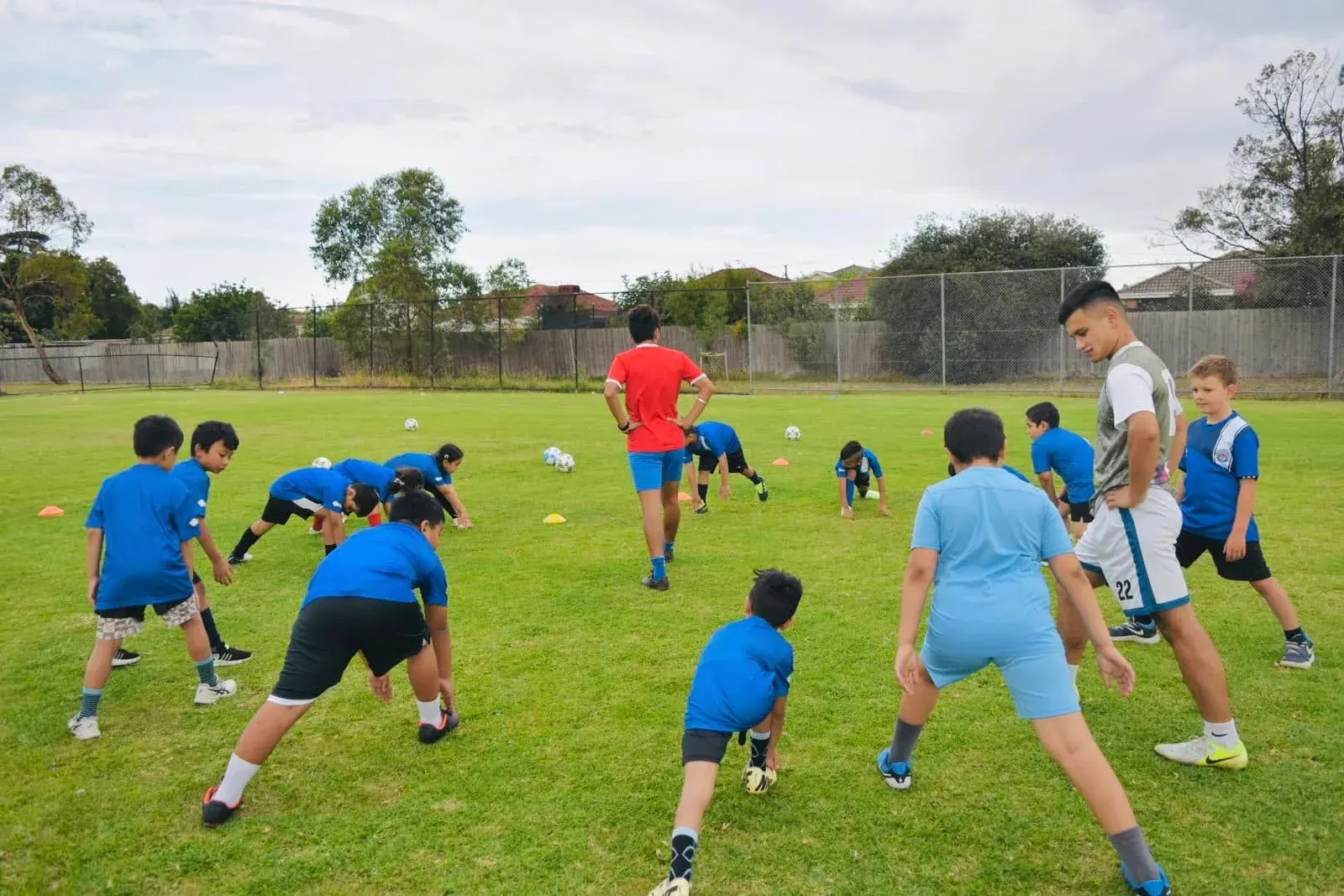 Coach demonstrating a drill to the academy players