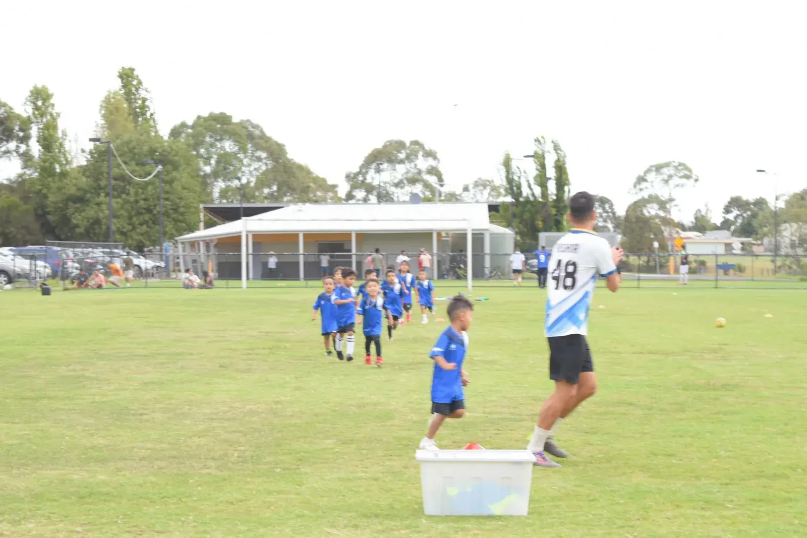 Young players running through a cone drill