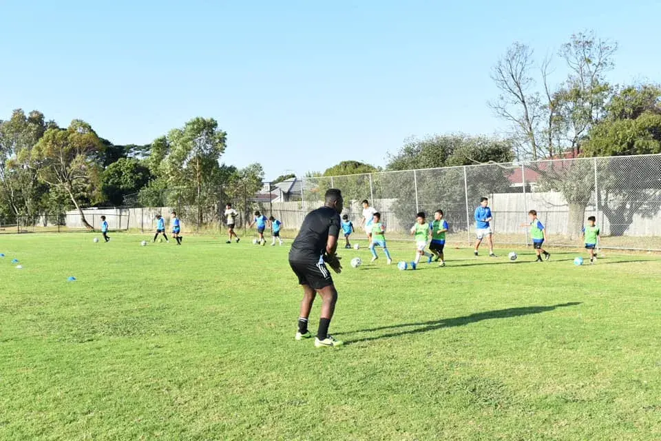 Coach on the academy training field