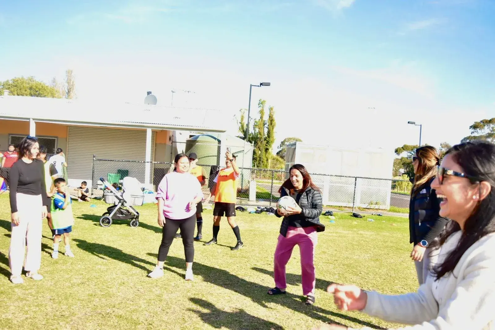 Families playing a group game on the field