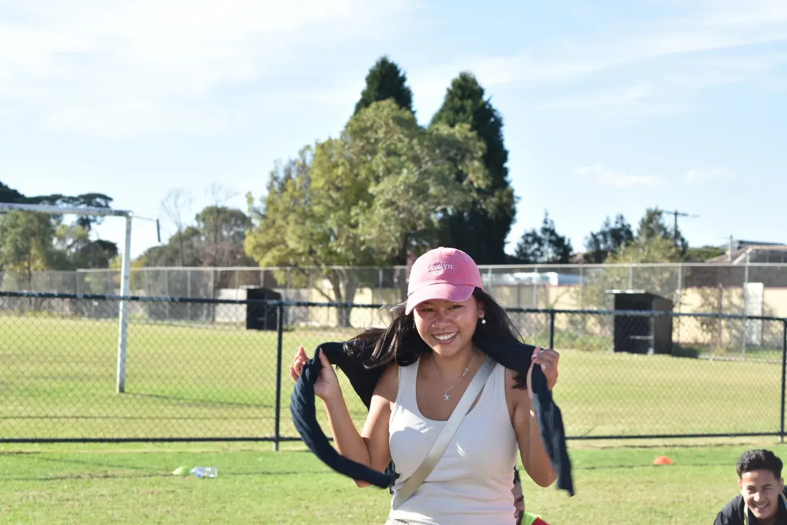 Participant in a pink cap during the celebration