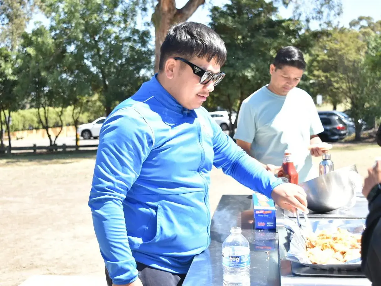 Club members preparing food at the barbecue