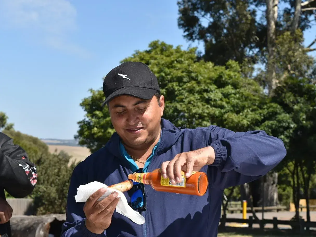 Participant serving a drink at the picnic