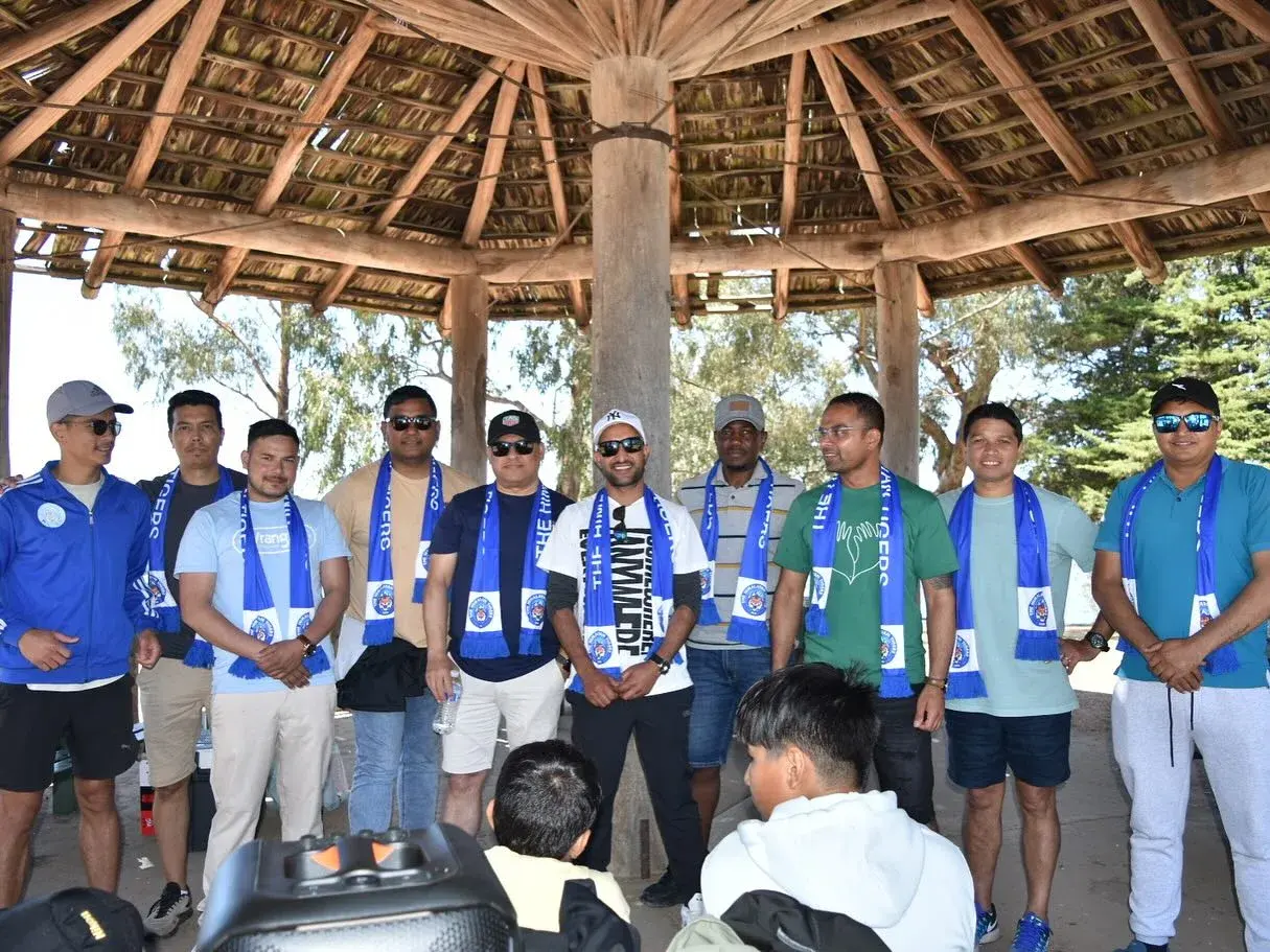 Club members gathered beneath the shelter