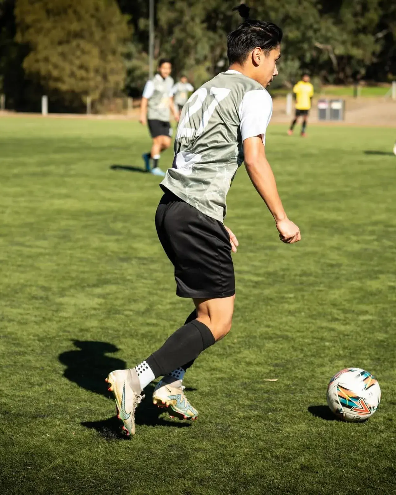 Tigers player controlling a ball on the field