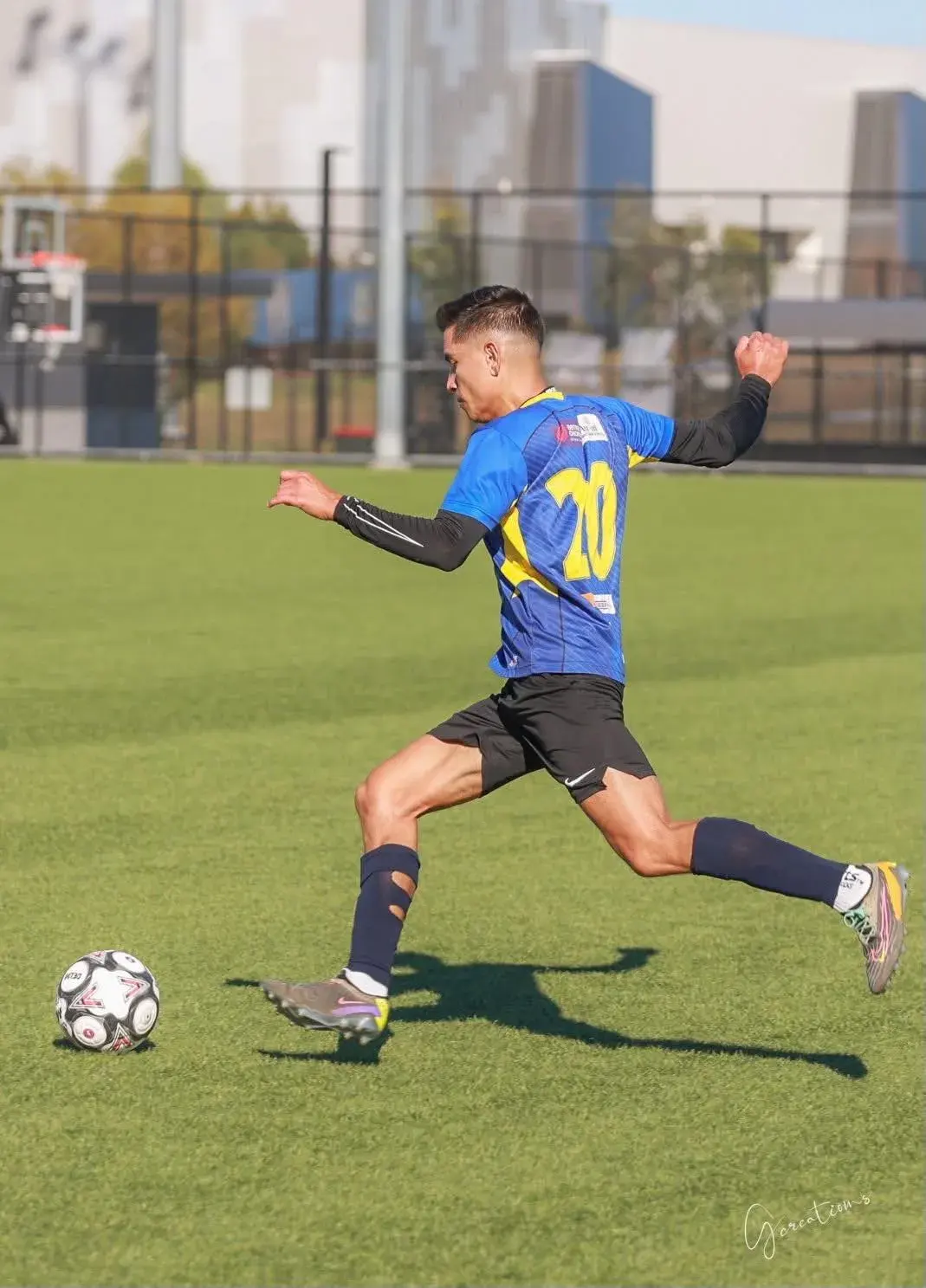 Young player kicking a football
