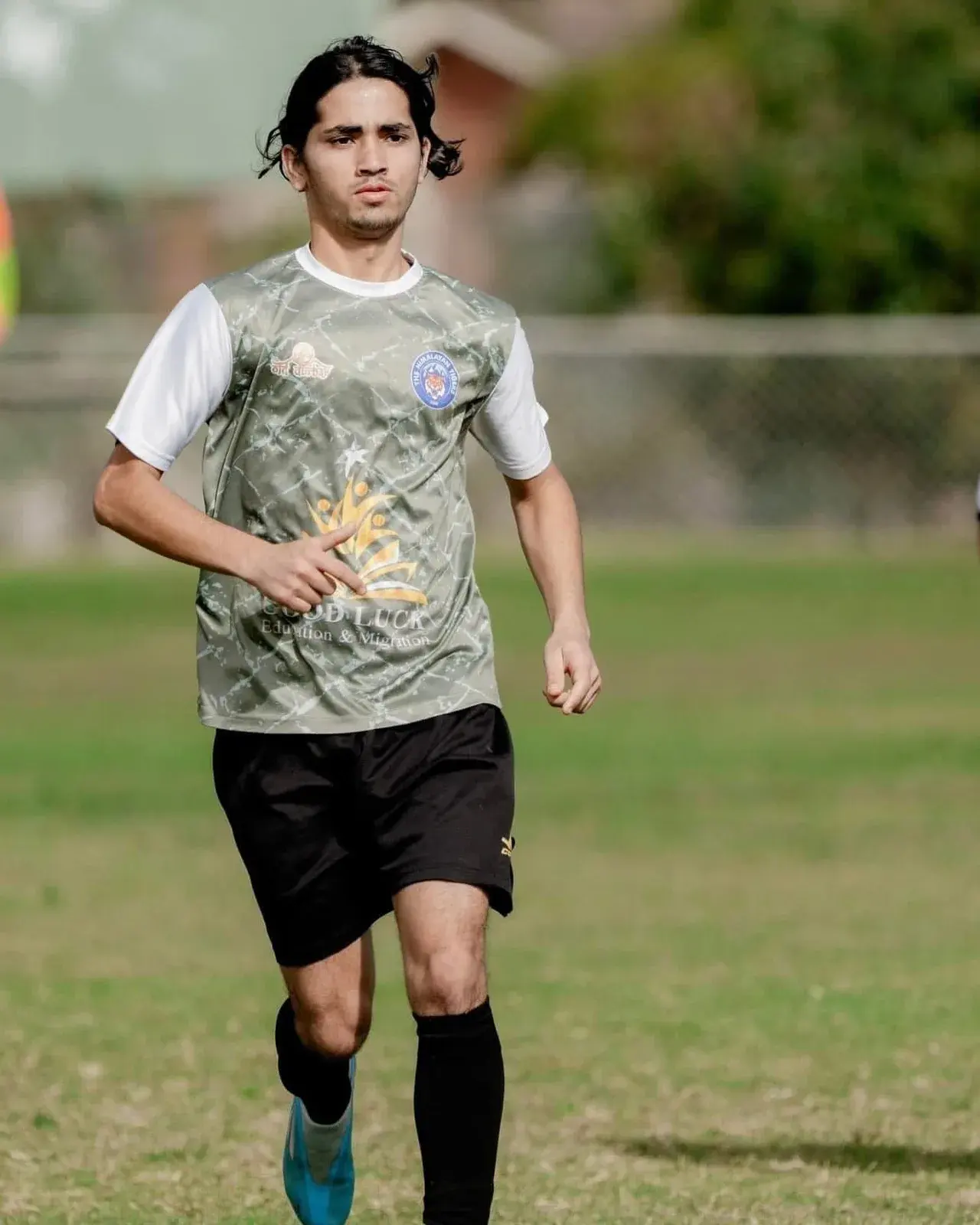 Tigers player jogging on the field