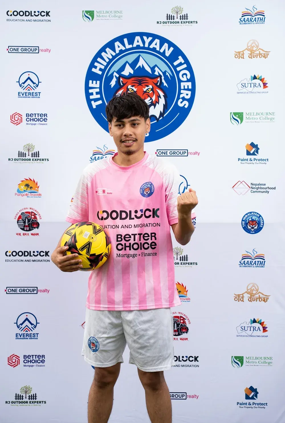Tigers player wearing the pink jersey with white shoulders and pale vertical stripes